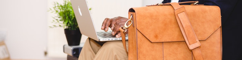 men with laptop and its bag