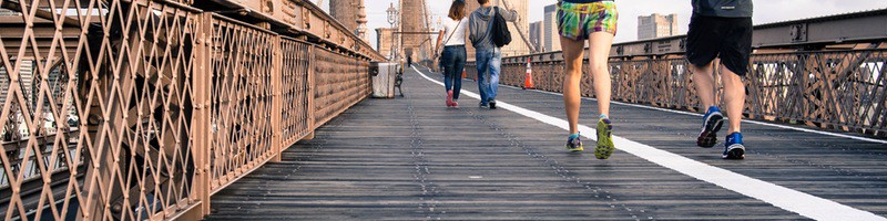 girl and guy running on road