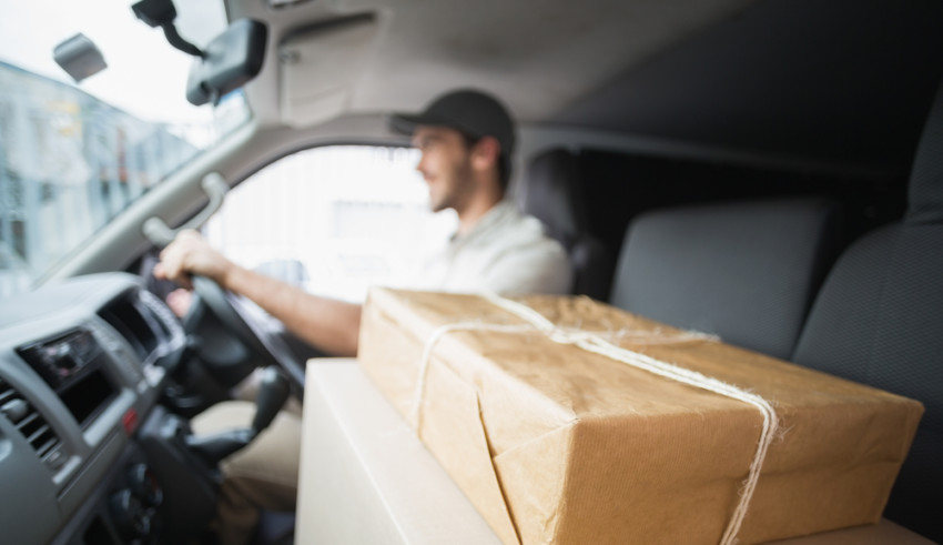 guy delivering package in van