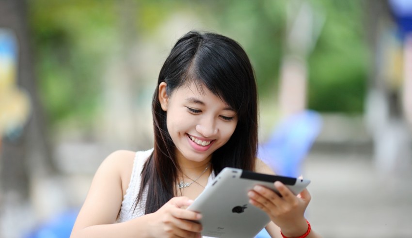 happy girl using tablet