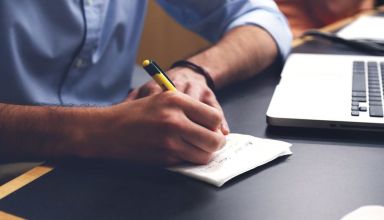 Boy writing and typing