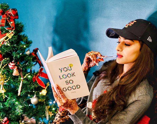 Erica Fernandes reading Book